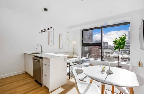 Mount Pleasant Apartment | Elegant Calgary Abode: Fitness Studio, Sauna, Billiards.