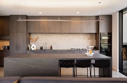 Frankton House | Elevated Elegance is a luxury retreat with dramatic views of the lake & mountains.