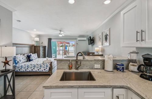 Bay Esplanade Apartment | Enchanted Inn Suite #4: Waterfront, Pool, Fishing Dock, Boat Docks & Tiki Bar!
