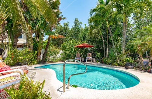 Palm Island House | Enchanted Private Island Oasis Steps To Beach, Tropical Yard & Charm Filled Home