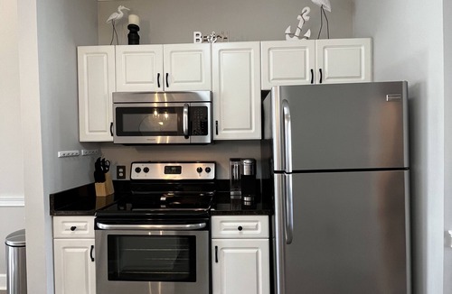 Central Myrtle Beach Condo | Endless Summer Updated Condo at Magnolia Place - Pool & Golf Course Views!