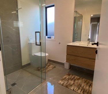 Wharewaka House | Ensuite bedroom at new house