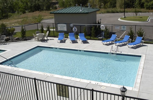 Rockrimmon Condo | Equipped Suite with Mountain View | Outdoor Pool Access, Housekeeping + Business Center