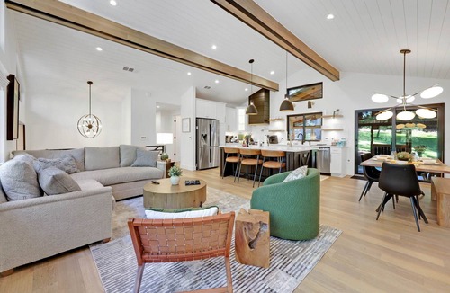 Friendly House | Eugene Evergreen Escape by Les Chalets Stays is a fully renovated home perfect for your crew! Game room, play house, sauna, outdoor entertaining space and huge back yard.