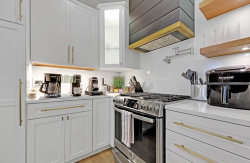 Friendly House | Eugene Evergreen Escape by Les Chalets Stays is a fully renovated home perfect for your crew! Game room, play house, sauna, outdoor entertaining space and huge back yard.