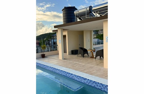 Salt Gut Apartment | Euphoria suite is a two bedroom, one bathroom unit with a private kitchen, living room, and laundry room. Perfect for groups or two traveling together seeking extra space, privacy, and elegant Caribbean comfort!