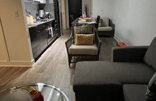 East Village Condo | Executive 1-Bed + Office Loft – Prime Riverfront, Gym, Near Stampede & City Life