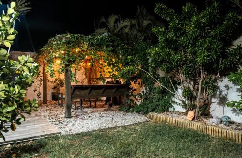 Bucana House | Expansive Paradise with Private Jacuzzi and Tropical Patio