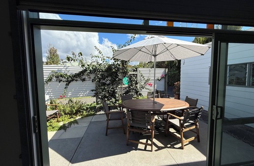 Manly House | Experience a Kiwi beach holiday here, a couple of minutes walk to the sand .