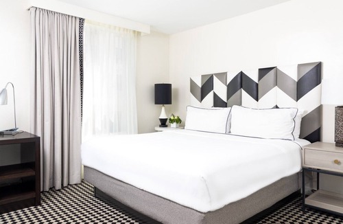 Norma Triangle Hotel | Experience a Luxurious Stay with 3 Modern Units! Rooftop Pool, Pet-friendly!