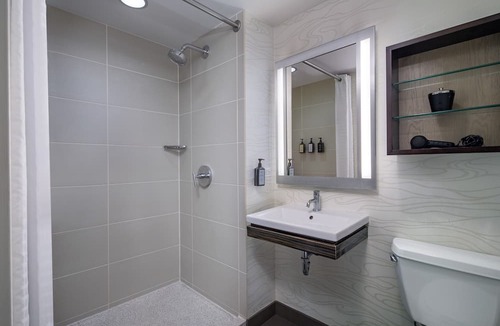 Near North Side Hotel | Experience Comfort in Eco-friendly Room w/Earth Tone Furniture