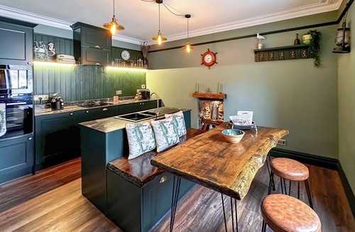 Sandhaven Cottage | Experience cosy comfort in this Cairnbulg holiday home, featuring a log fire.