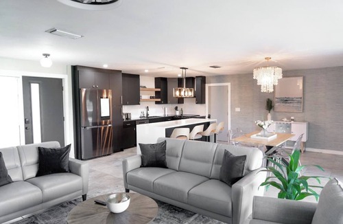 Yacht Club House | Experience modern waterfront living in Cape Coral’s Yacht Club district. Walk to the beach for stunning sunsets, plug in with on-site EV charging, and keep your boat moored at our private backyard dock. Direct gulf access with no bridges!