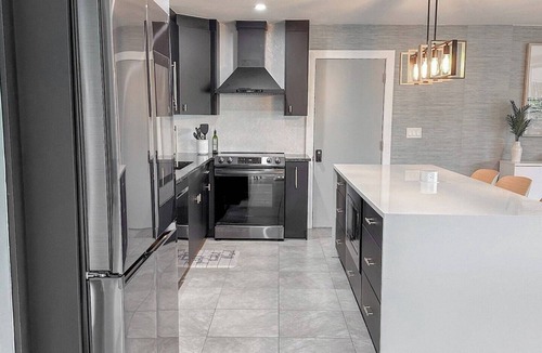 Yacht Club House | Experience modern waterfront living in Cape Coral’s Yacht Club district. Walk to the beach for stunning sunsets, plug in with on-site EV charging, and keep your boat moored at our private backyard dock. Direct gulf access with no bridges!