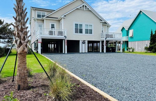 Holden Beach House | Experience oceanfront luxury at FINS, a spacious 10-bedroom retreat in Holden Beach.
