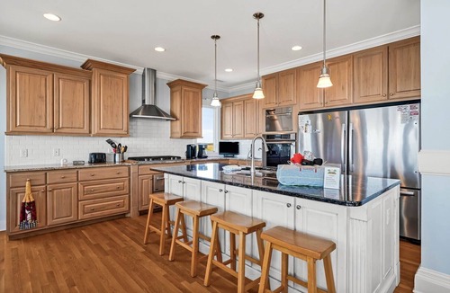 Caswell Beach House | Experience oceanfront luxury at 'Our American Dream' in Oak Island, NC, perfect for 19 guests!