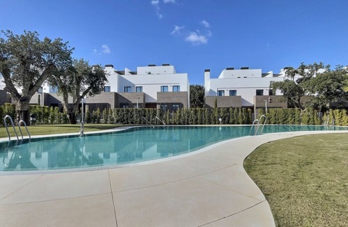 San Roque House | Experience sophistication in this contemporary four-bedroom frontline golf townhouse