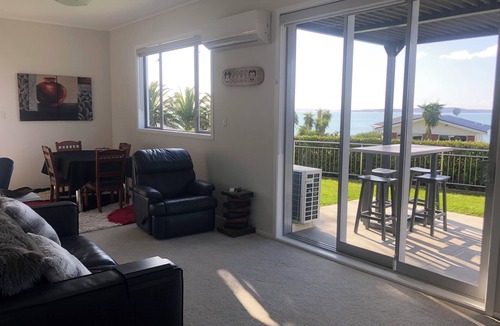 Maraetai Apartment | Experience spectacular elevated sea views and relax on white sandy beaches.