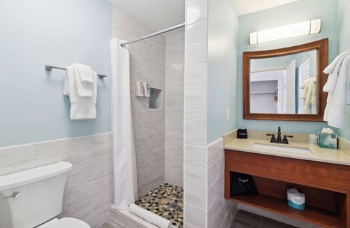 Neptune Beach Hotel | Explore Local Gems from a Relaxing Beachfront Room with Outdoor Swimming Pool