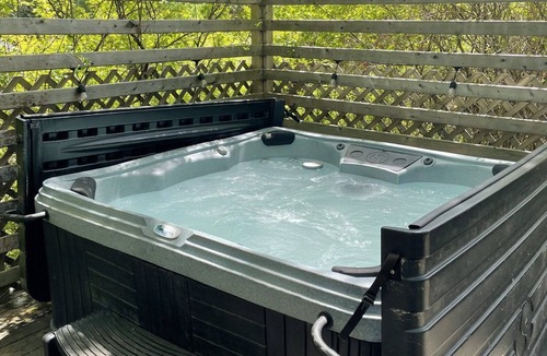 Saint Patrick RV Rental | Explorer Glamping Tent! Forest Retreat & Hot Tubs!