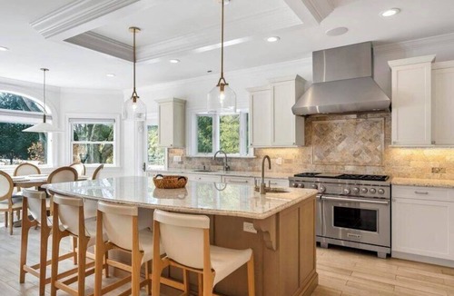 Tuckahoe House | Exquisite Southampton estate with a private heated pool and expansive.