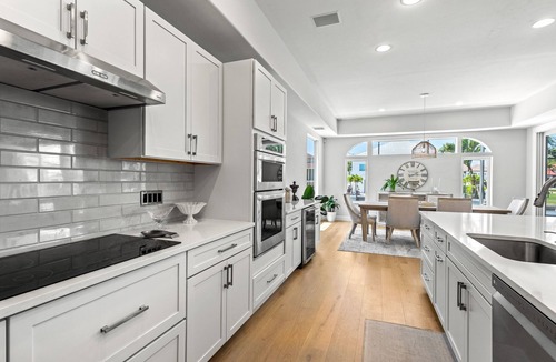 Vanderbilt Beach House | Exquisite waterfront home with lanai, heated pool and spa(hot tub), and internet