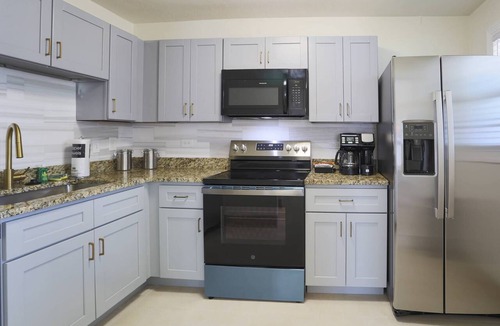 Treasure Island Condo | Family Reunion, Weddings, Group Celebrations - Beach Access, Near Dock & Kayak Launch + BBQ & Patios