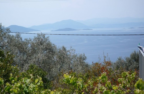 Kalamos House | Fantastic natural stone house with 180° sea view, pool and beautiful garden