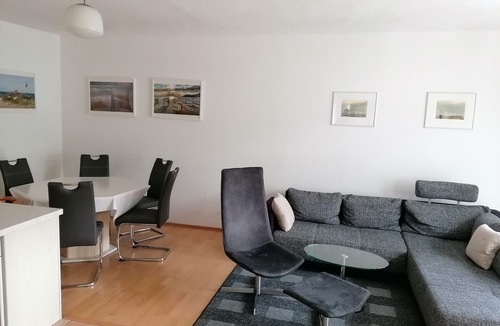 Riemserort House | First floor apartment by the water with terrace, carport parking space and WLAN