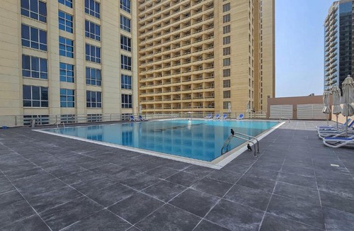 Dubai Production City Apartment | Free Housekeeping Visits During Your Stay - StayShort - Inviting Studio in Production City for 4