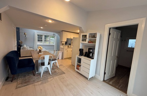 Warwick House | Freshly renovated waterfront retreat in Warwick Cove! This cozy 1-bedroom features a loft-style king bed, queen sleeper sofa, spacious deck, fenced yard, and open backyard leading to the water - perfect for a relaxing coastal escape.