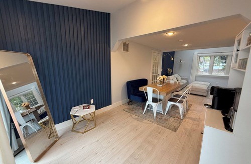 Warwick House | Freshly renovated waterfront retreat in Warwick Cove! This cozy 1-bedroom features a loft-style king bed, queen sleeper sofa, spacious deck, fenced yard, and open backyard leading to the water - perfect for a relaxing coastal escape.