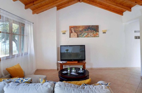 Longos House | From its elevated position directly above Levrecchio beach, this wonderfully light and airy villa en