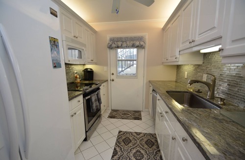 Moorings Condo | Front unit overlooking Moorings bay - 7 min walk to the Beach. 2 boat slips