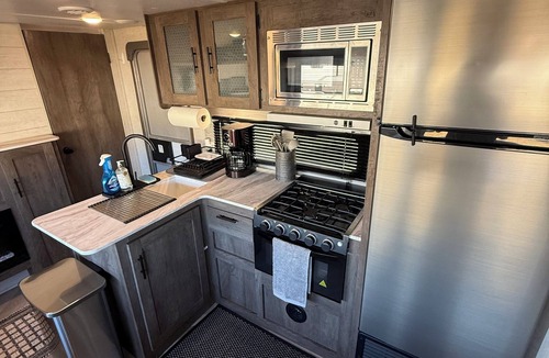Theodore RV Rental | fully set up camper ready to go, located at Homestead RV Community park