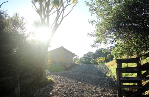 Waitakere RV Rental | Glamping in Waitakere in this Luxury Safari Tent Rental, for the Best Vacations in New Zealand