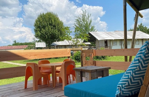 Jayac RV Rental | Glamping 'Safarilodge Confort Tent 2-6 Pers' with Private Terrace, Shared Garden and Wi-Fi