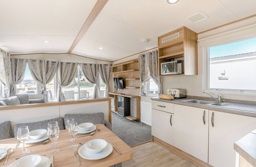 Ryde House | Gold Caravan with decking