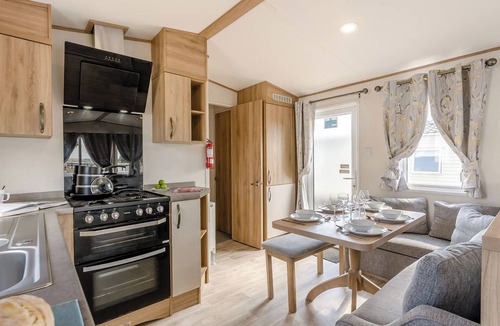 Ryde House | Gold Caravan with decking