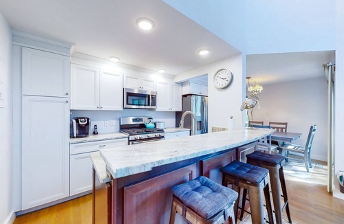 Mews Village House | Golf-course-front townhome with leafy patio & prime location near the beach