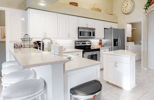 Long Meadow House | Golf course-view retreat with a private, heated pool, lanai, AC, & washer/dryer