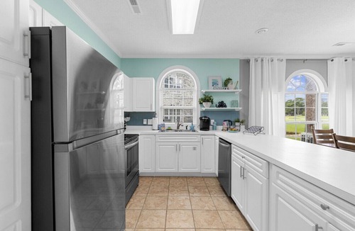 Central Myrtle Beach Apartment | Golf View - Pool - Full Kitchen - King Bed