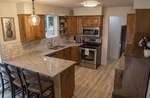 Sunset Heights House | Gorgeous island-themed retreat sleeps 30 in Orem, UT!