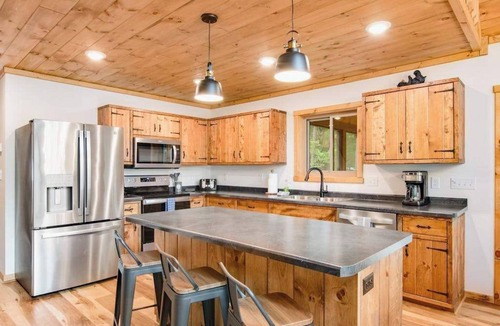 Eagle River House | Gorgeous lake home with private pier, beach, firepit, deck, & grill + water toys