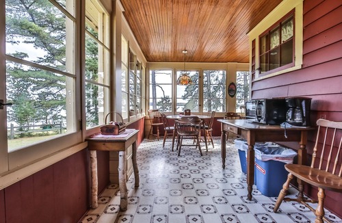 St Germain House | Gorgeous lakefront cabin, wrap-around enclosed porch, dock!
