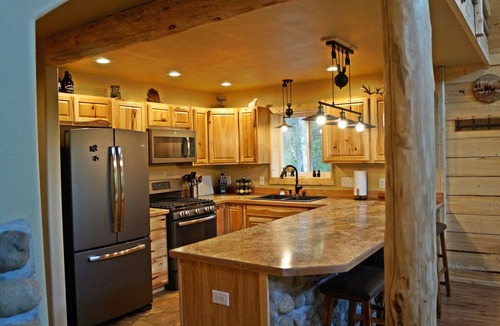 Sutton-Alpine Cabin | Gorgeous Log Cabin With Huge Wraparound Porch