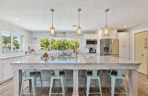 Cocoa Isles House | Gorgeous Private Canal Home w/Pool, Hot Tub & Modern Kitchen - Walk to Restaurants!