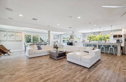 Cocoa Isles House | Gorgeous Private Canal Home w/Pool, Hot Tub & Modern Kitchen - Walk to Restaurants!