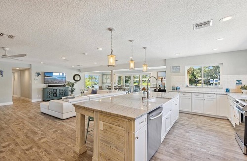 Cocoa Isles House | Gorgeous Private Canal Home w/Pool, Hot Tub & Modern Kitchen - Walk to Restaurants!