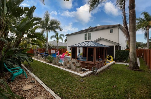 Tropic House | Gorgeous Urban Oasis W/hot Tub, Heated Pool And Private Movie Theater 3 Bedroom Home by RedAwning